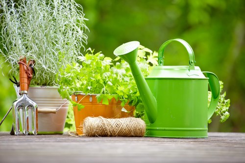 Gardener preparing soil with compost in a Wandsworth garden