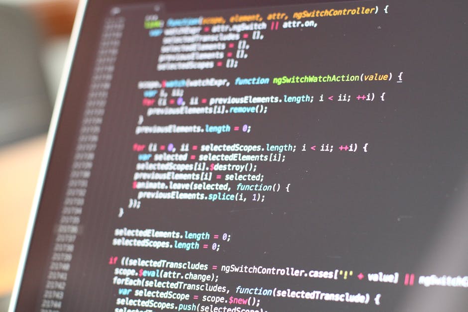 A close-up view of a computer screen displaying lines of colorful programming code, with a focus on JavaScript syntax including functions, variables, and loops. The background is slightly blurred, emp
