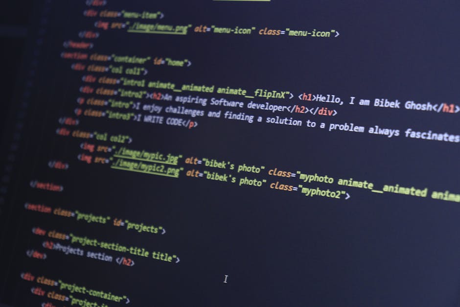 A high-resolution close-up image of a computer screen displaying lines of HTML code with various tags and attributes in multiple colors, including blue, red, yellow, and green. The code appears to be